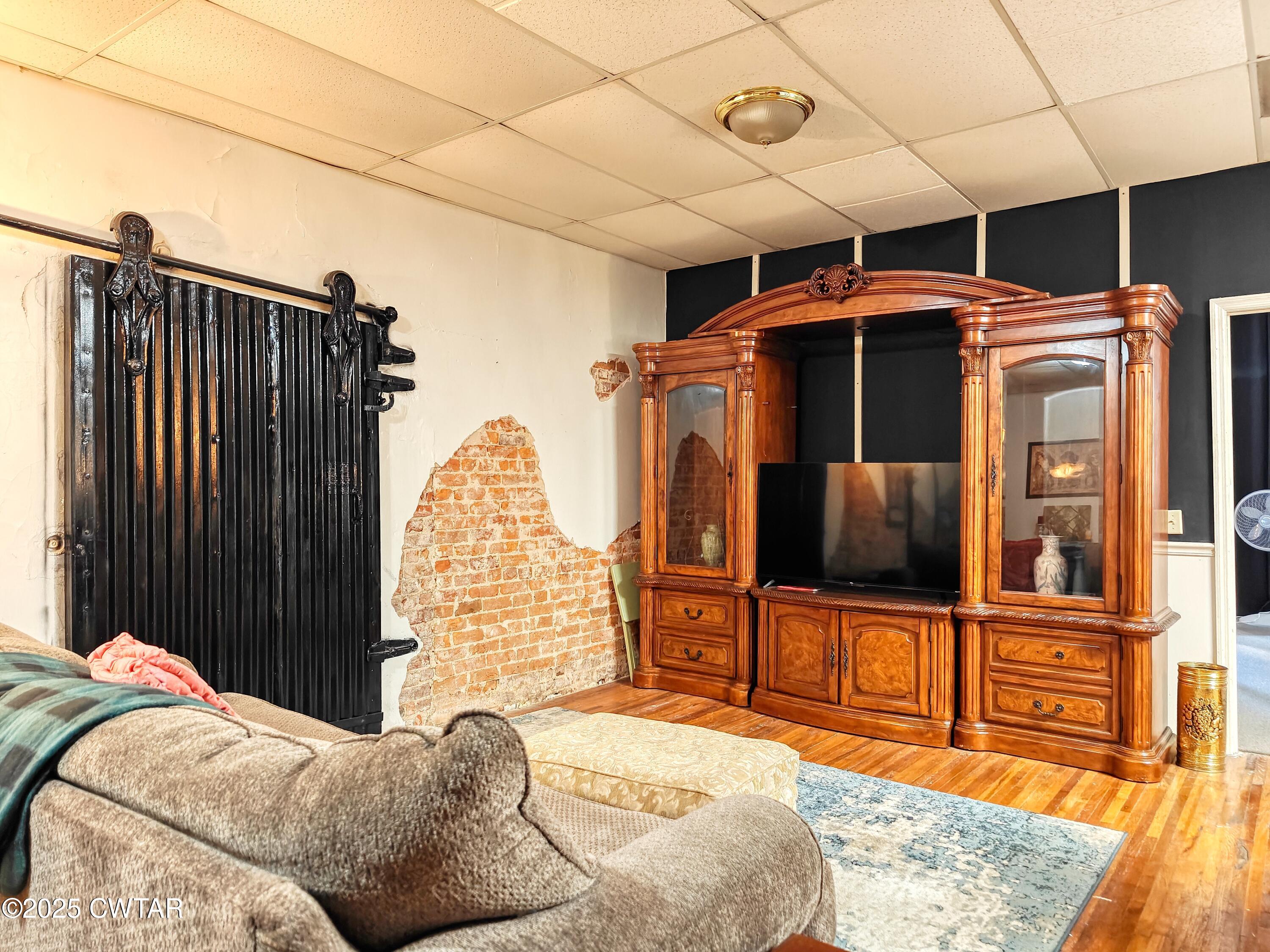 121 North Poplar Street Paris, TN 38242 - Photo 14 of 38 a bedroom with furniture and window