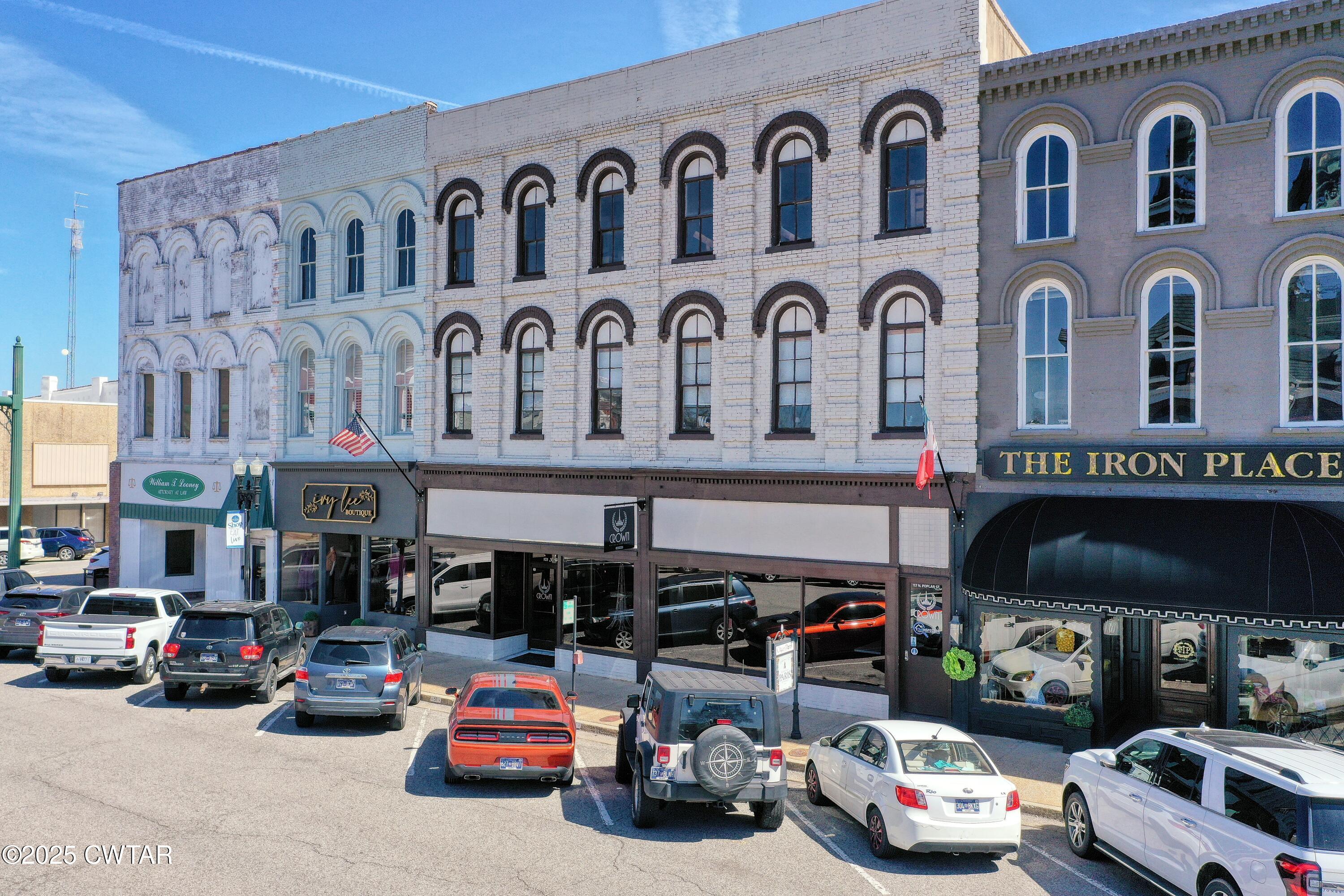 121 North Poplar Street Paris, TN 38242 - Photo 2 of 38 a car parked in front of a building