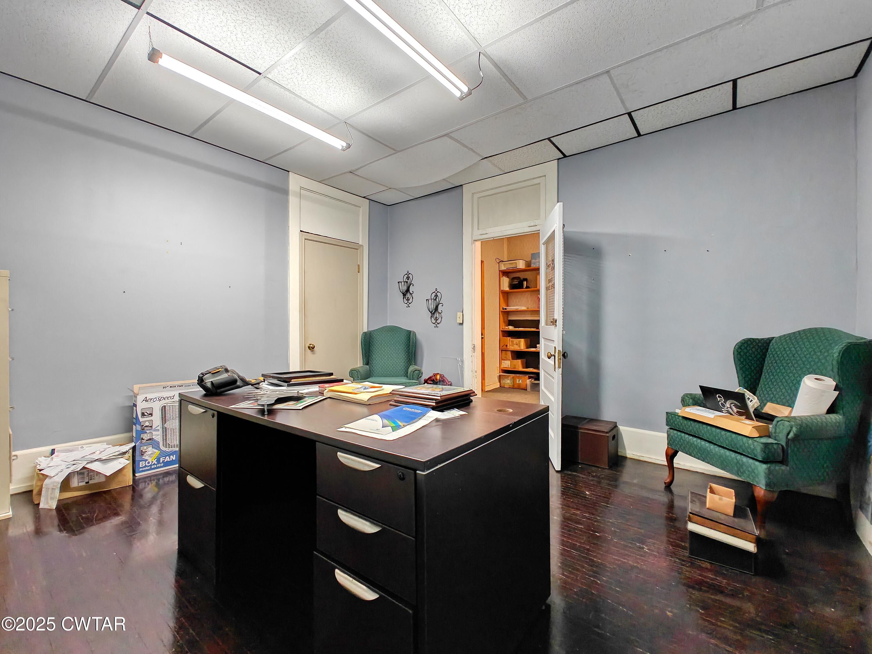 121 North Poplar Street Paris, TN 38242 - Photo 27 of 38 a view of a workspace with furniture and a window