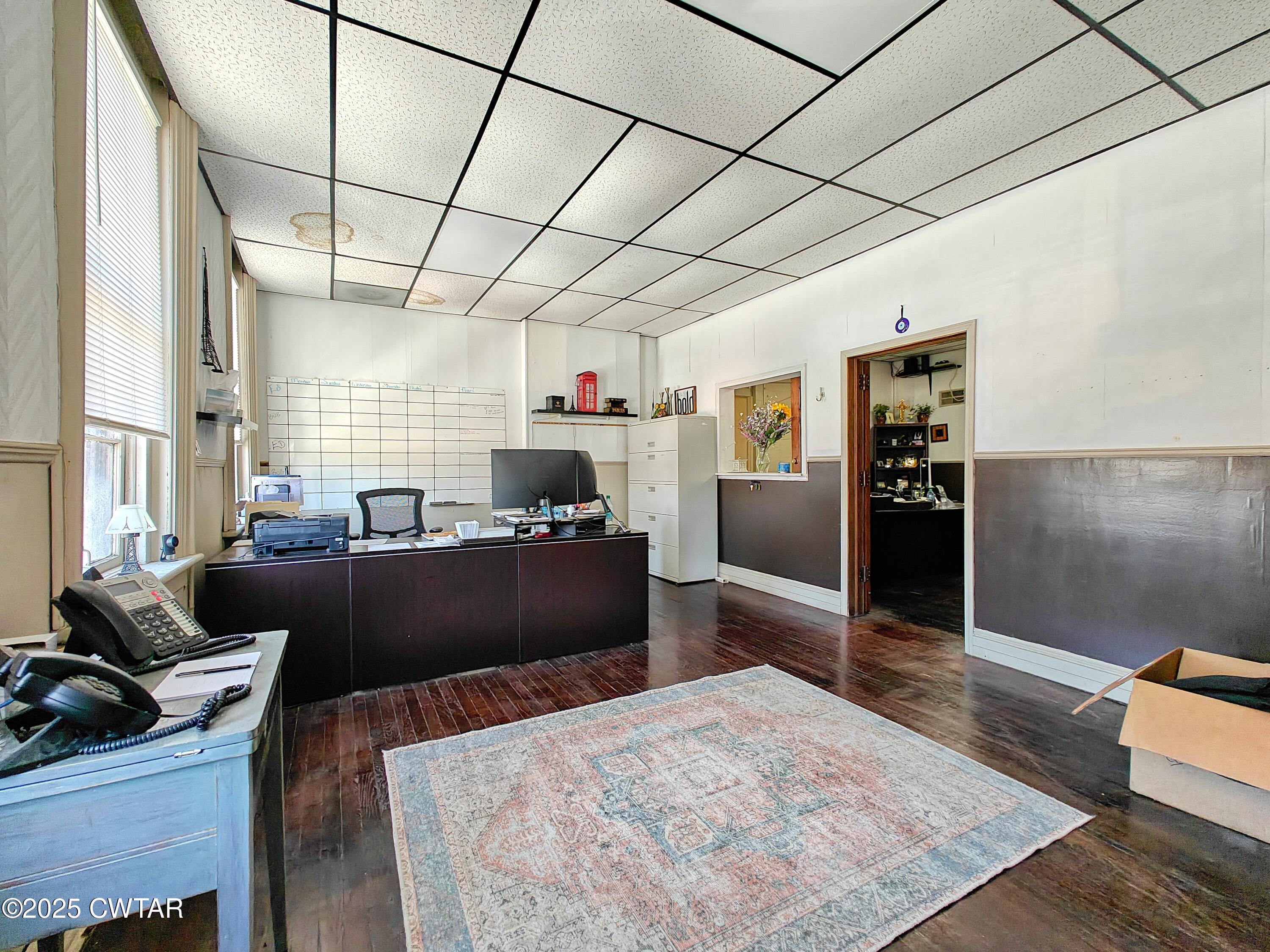 121 North Poplar Street Paris, TN 38242 - Photo 30 of 38 a living room with furniture and a flat screen tv