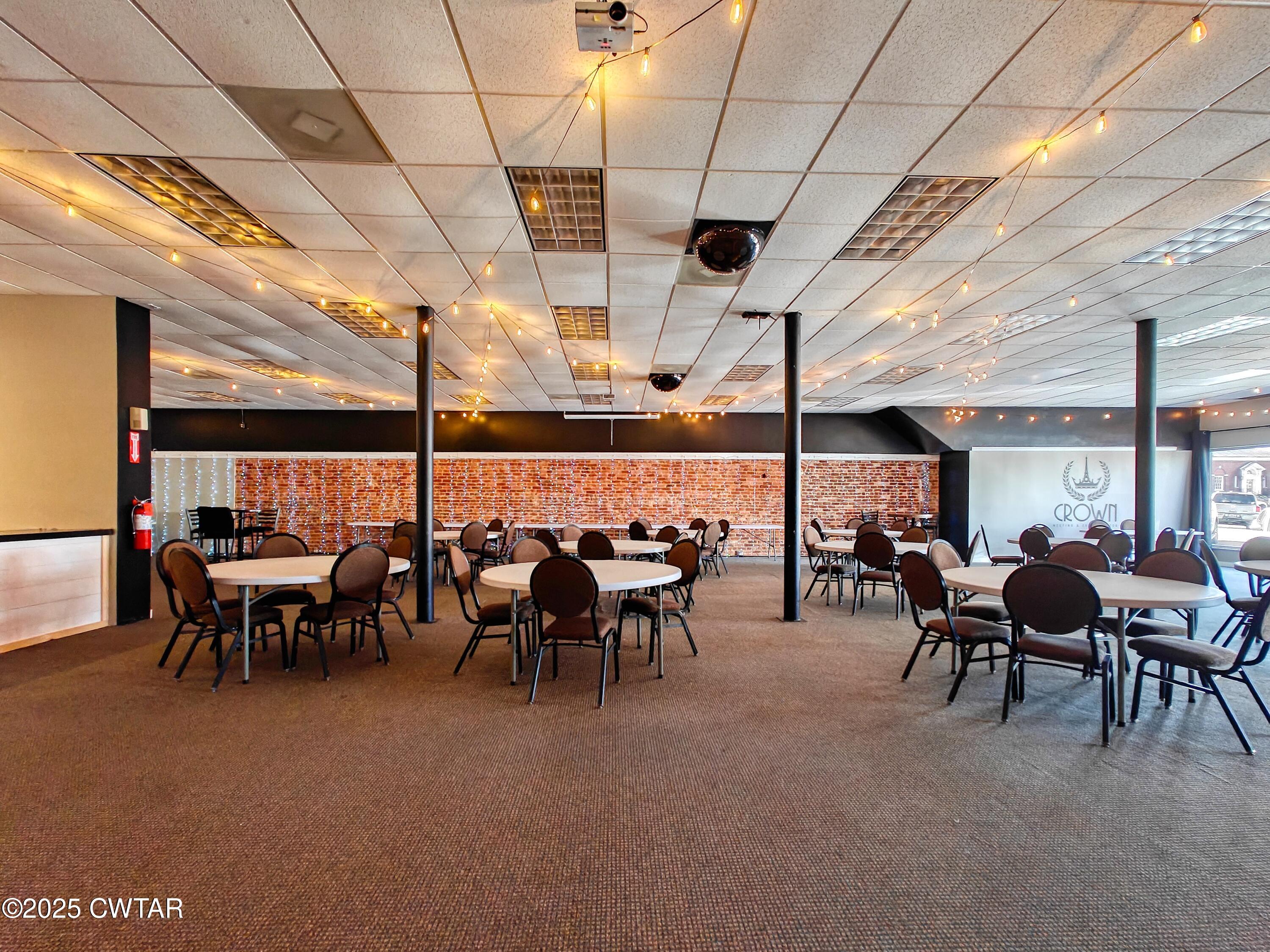 121 North Poplar Street Paris, TN 38242 - Photo 32 of 38 a group of people sitting in a room