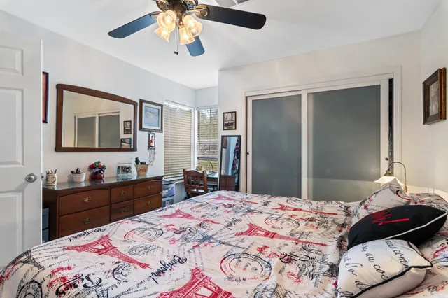 a bedroom with a bed and a dresser