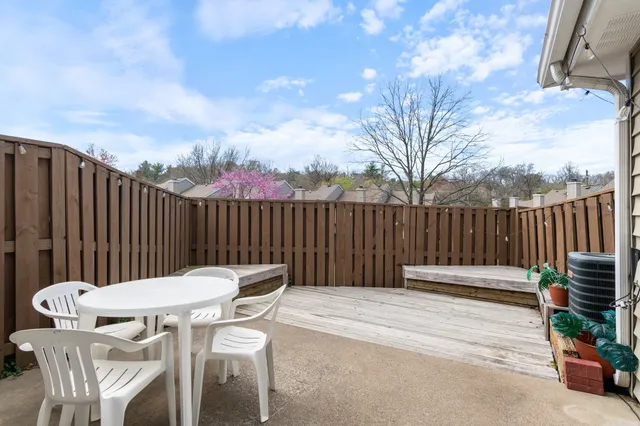 a view of a chairs and tables in the back yard of the house