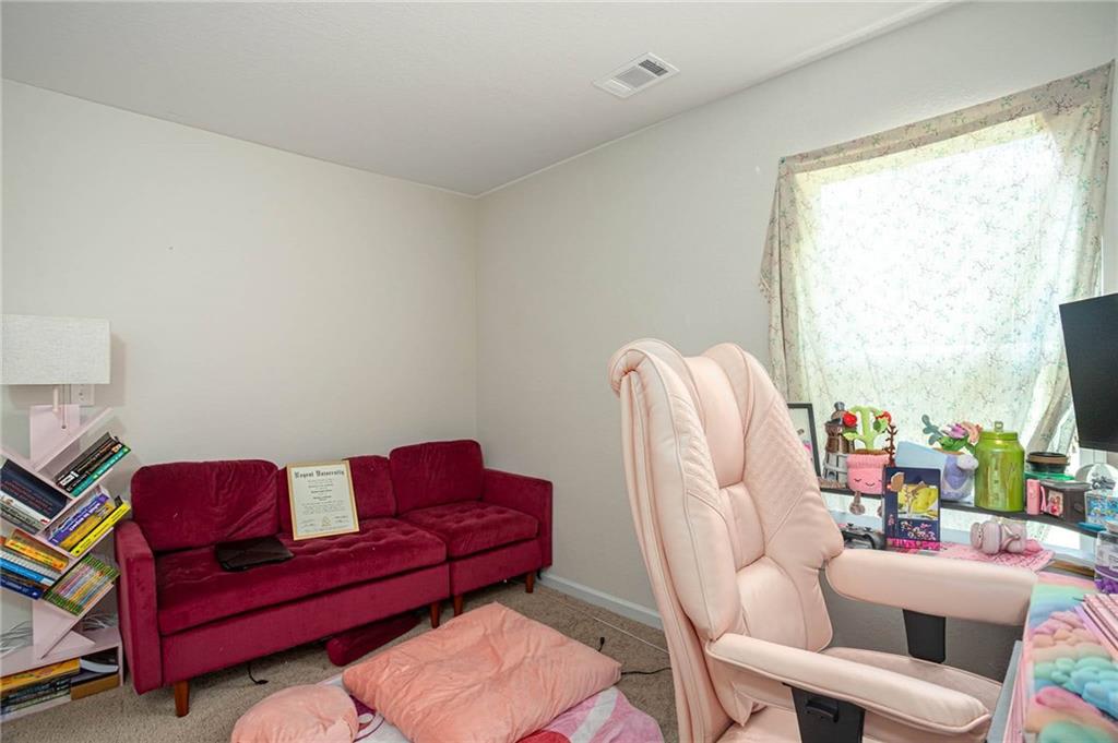635 Meadows Farm Way Monroe, GA 30655 - Photo 31 of 36 a living room with furniture a couch and a window