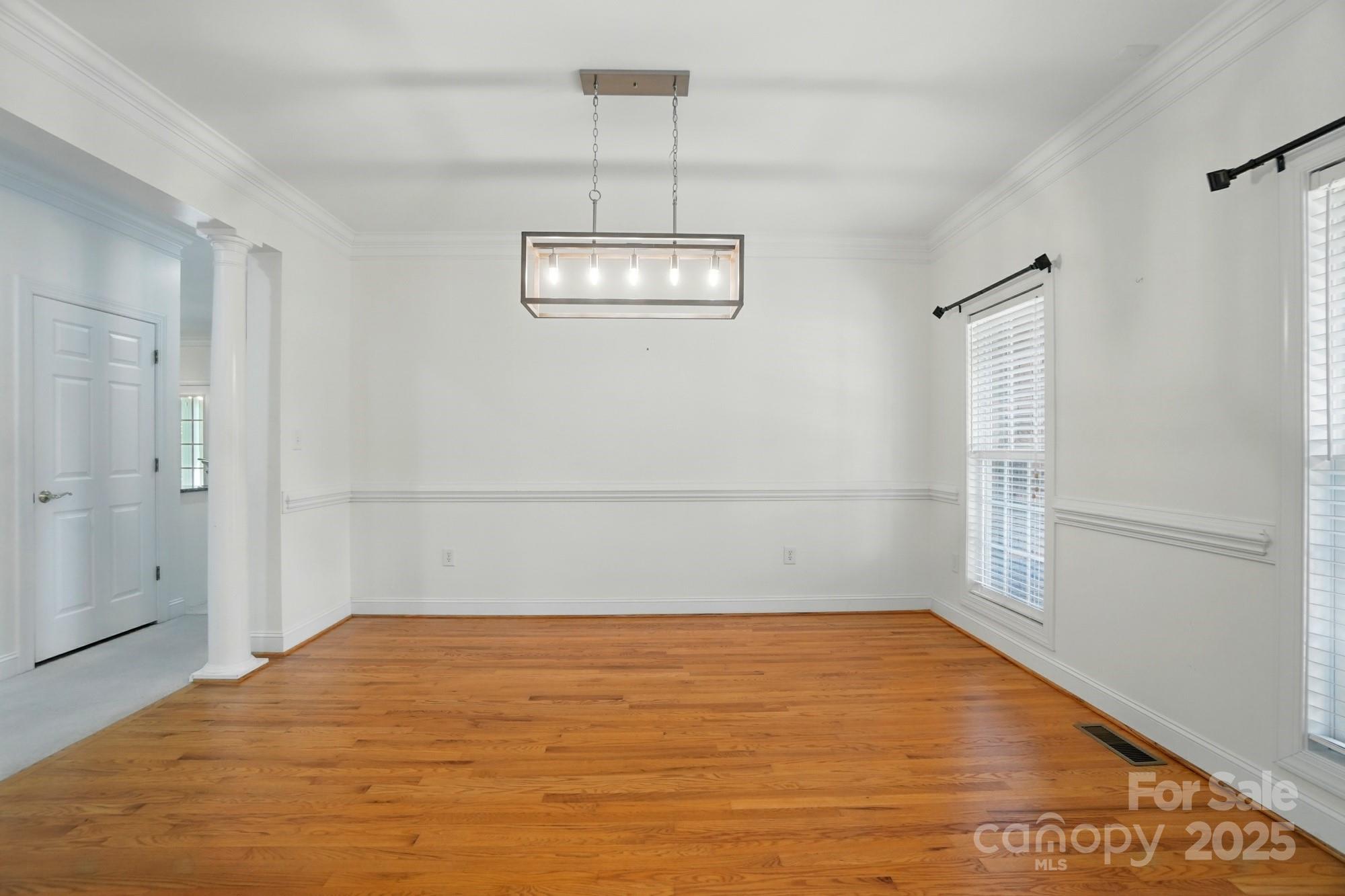 201 Limerick Drive Matthews, NC 28104 - Photo 13 of 34 a view of a room with wooden floor and white walls
