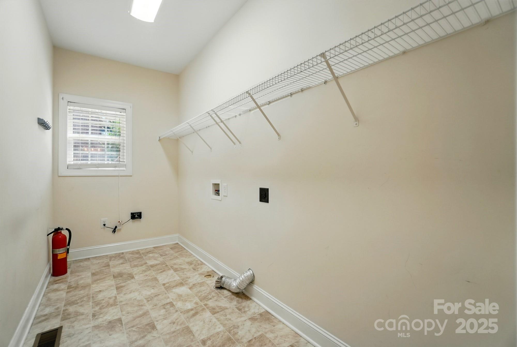 201 Limerick Drive Matthews, NC 28104 - Photo 16 of 34 a view of a room with rack on the wall