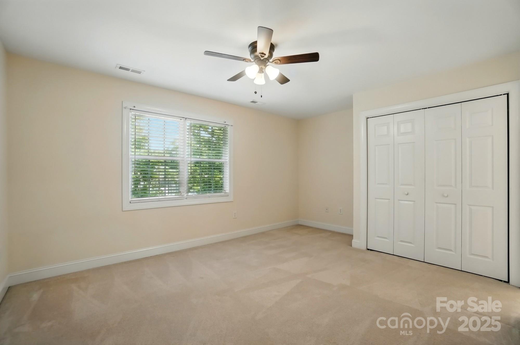 201 Limerick Drive Matthews, NC 28104 - Photo 24 of 34 an empty room with fan and windows