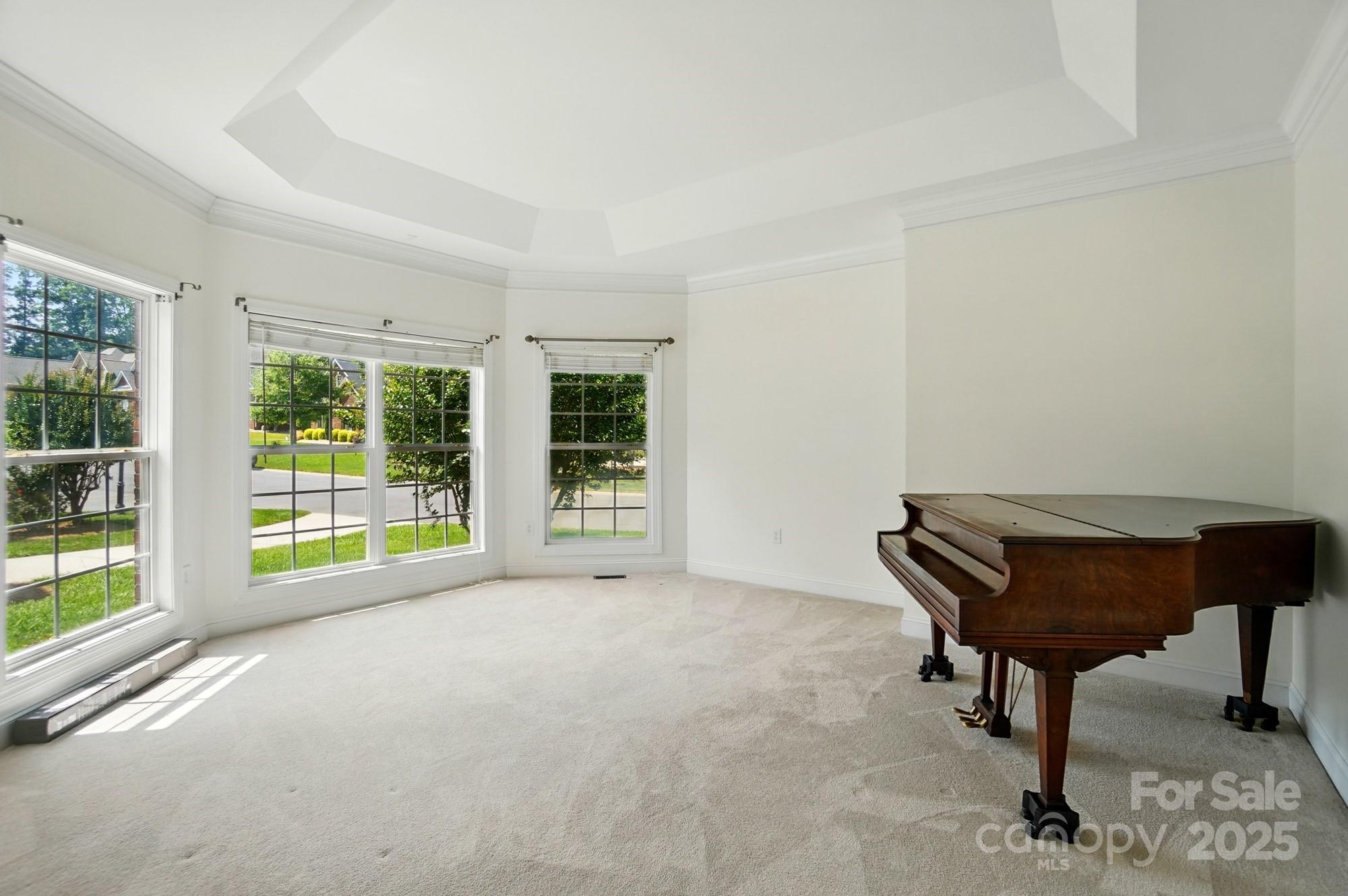 201 Limerick Drive Matthews, NC 28104 - Photo 7 of 34 a living room with furniture and a floor to ceiling window