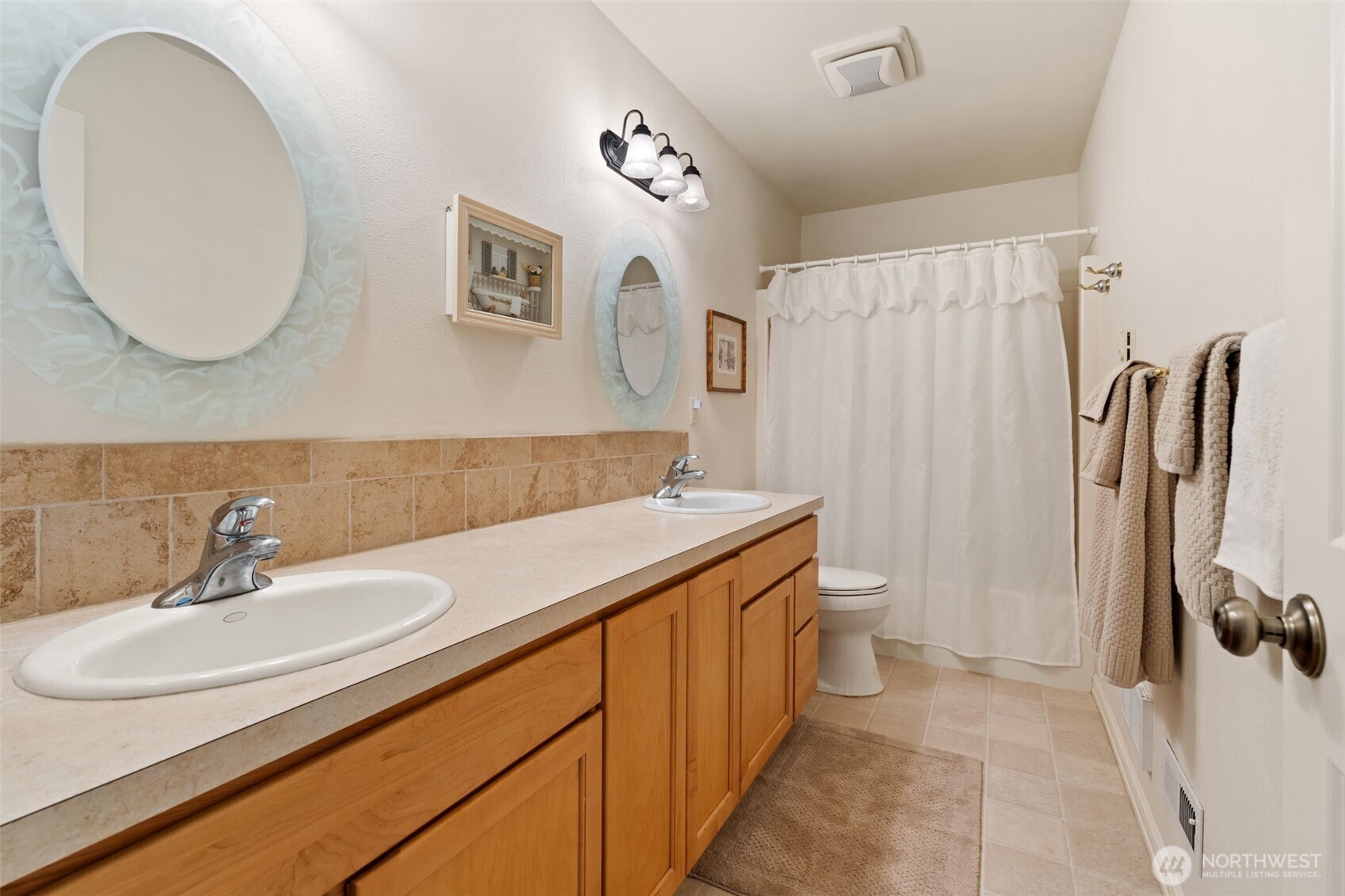 301 Russell Road Winlock, WA 98596 - Photo 17 of 40 a bathroom with a sink and a mirror