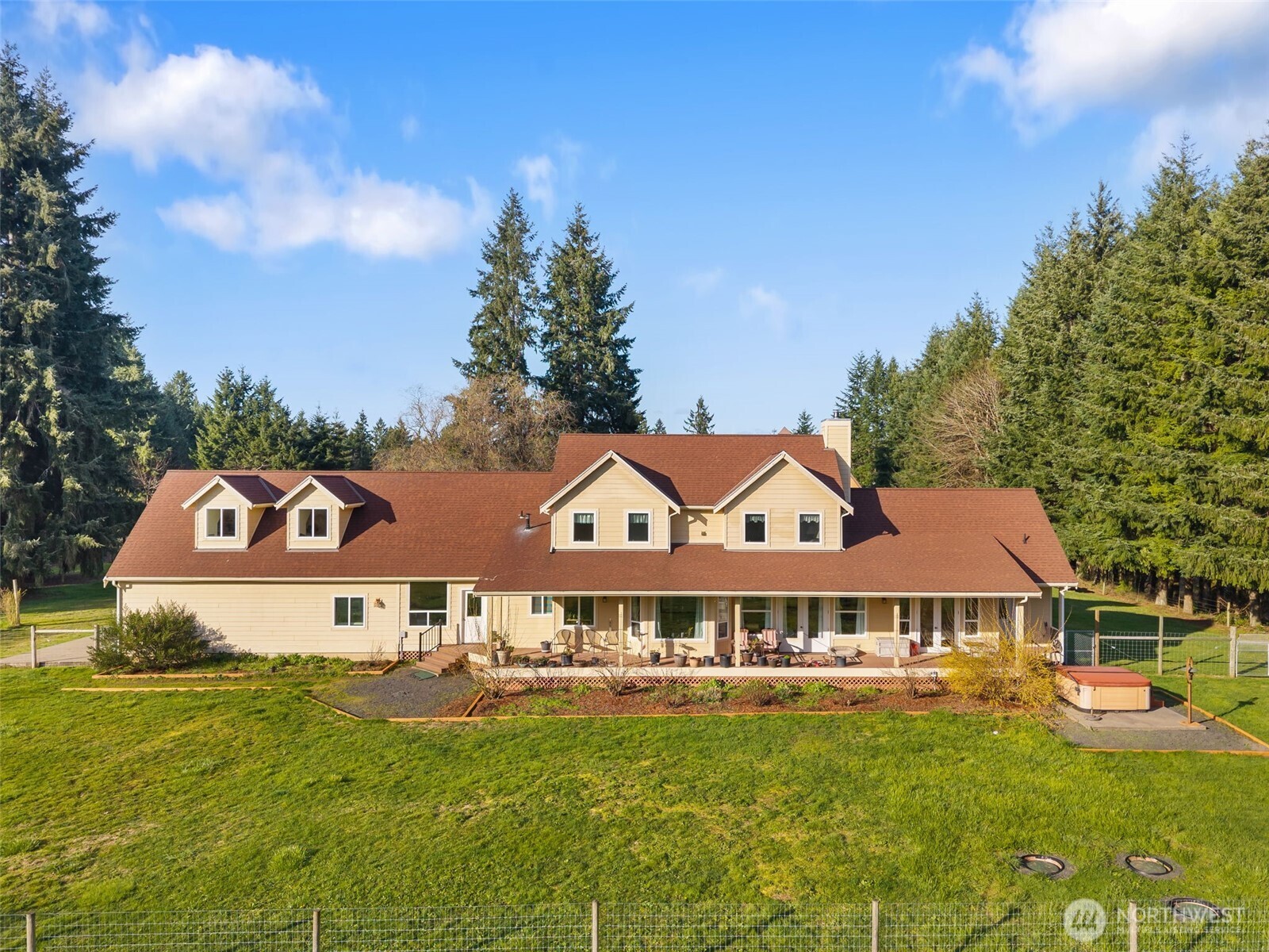 301 Russell Road Winlock, WA 98596 - Photo 2 of 40 a view of a big house with a big yard and large trees