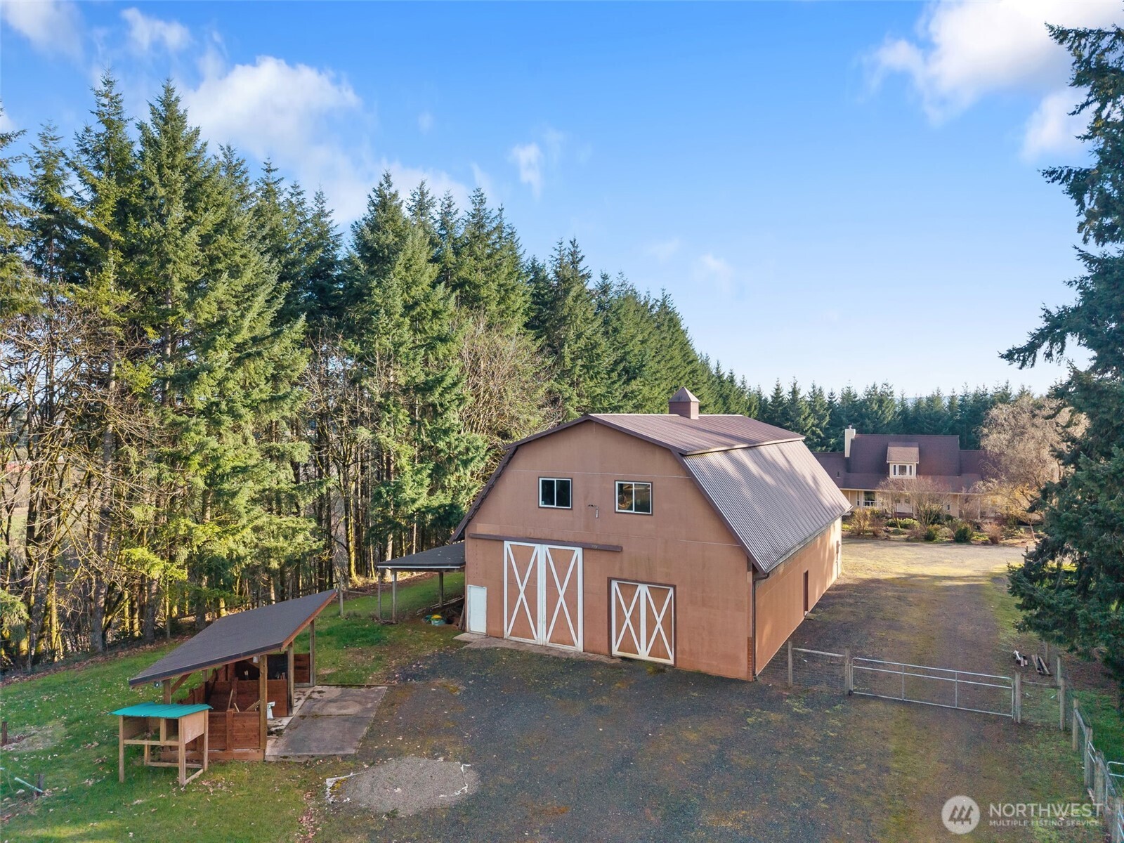 301 Russell Road Winlock, WA 98596 - Photo 29 of 40 a roof deck with table and chairs under an umbrella
