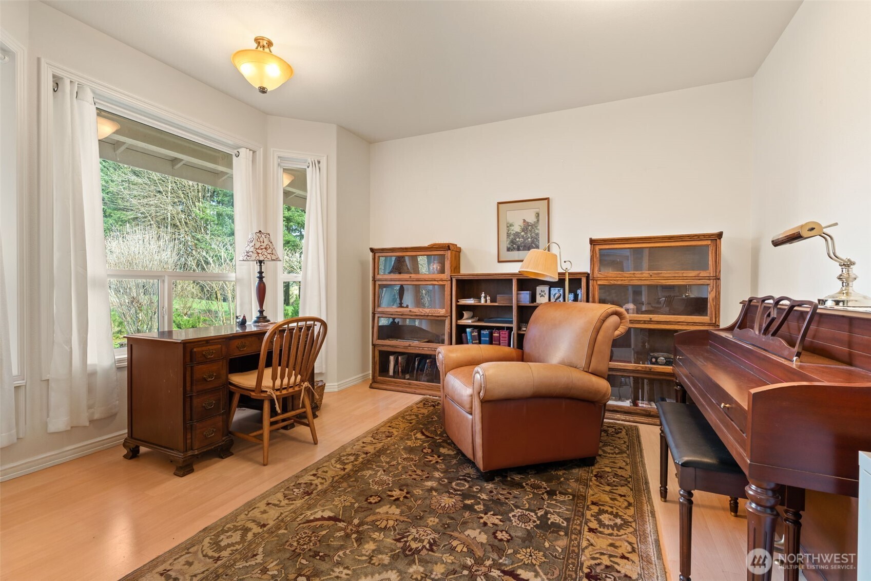 301 Russell Road Winlock, WA 98596 - Photo 8 of 40 a living room with furniture a computer on the desk and a rug