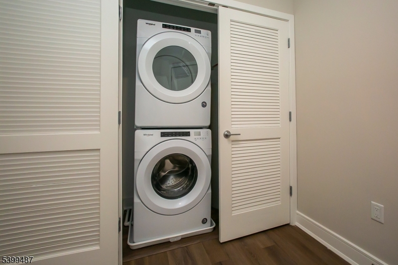 74 Passaic Avenue, Unit 107 Fairfield, NJ 07004 - Photo 13 of 13 a utility room with dryer and washer
