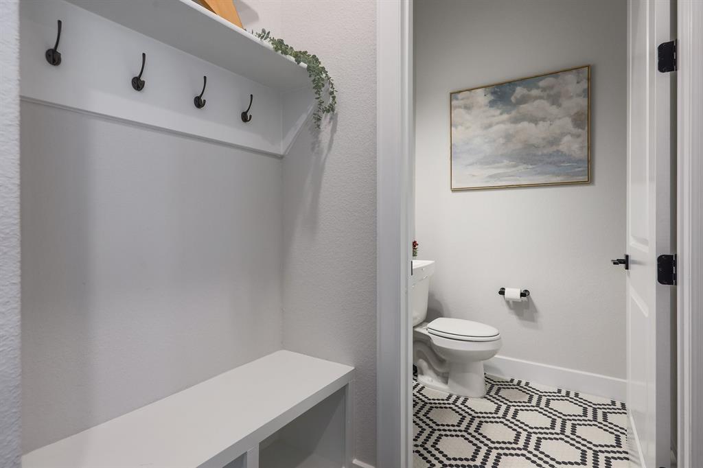 3907 Tilley Street Austin, TX 78723 - Photo 11 of 26 a bathroom with a toilet and a shower