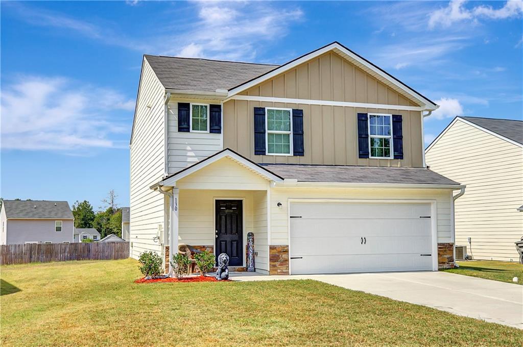 130 Catalpa Road Milner, GA 30257 - Photo 1 of 23 a front view of a house with a yard
