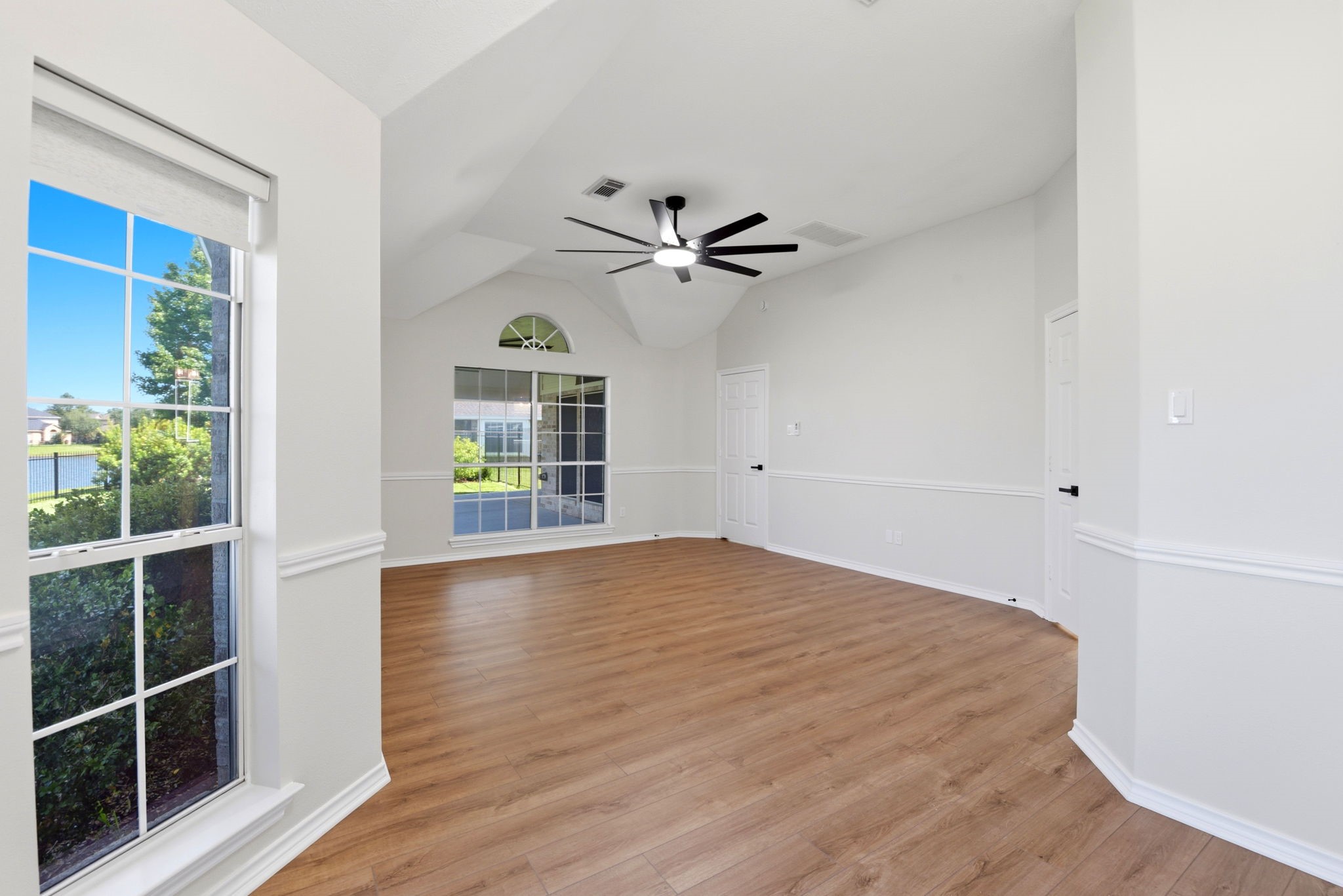 29819 South Legends Village Circle Spring, TX 77386 - Photo 24 of 48 a view of an empty room with a window and wooden floor