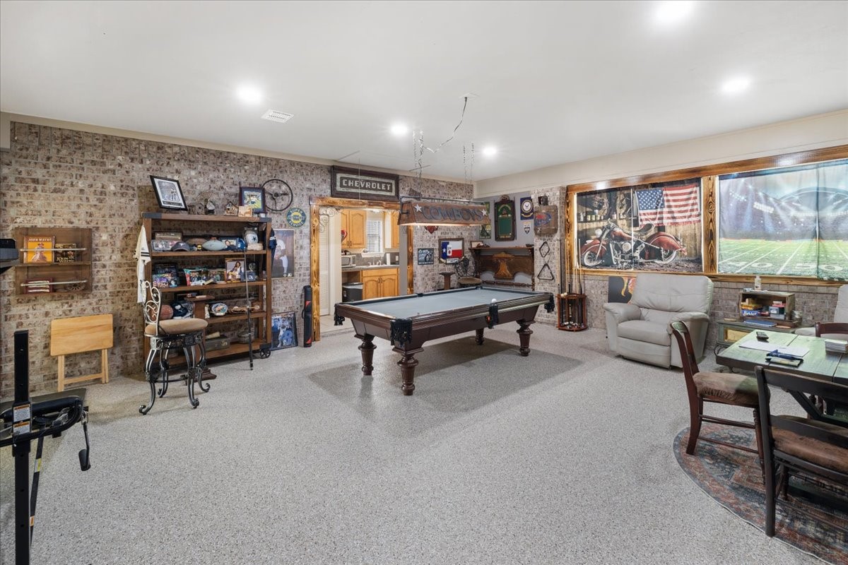 755 Mallard Street Hemphill, TX 75948 - Photo 9 of 27 a living room with furniture a rug and gym equipment