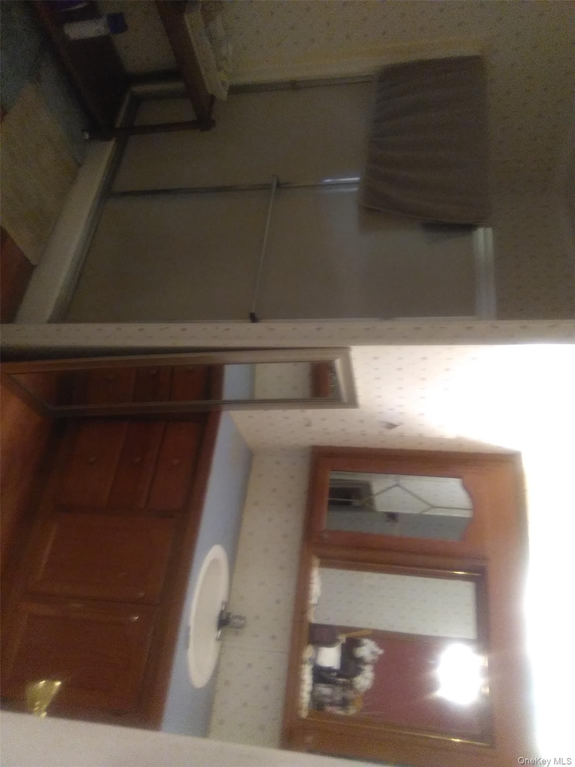 2032 Champlin Road Jefferson, NY 12093 - Photo 15 of 20 a bathroom with a double vanity sink and a mirror