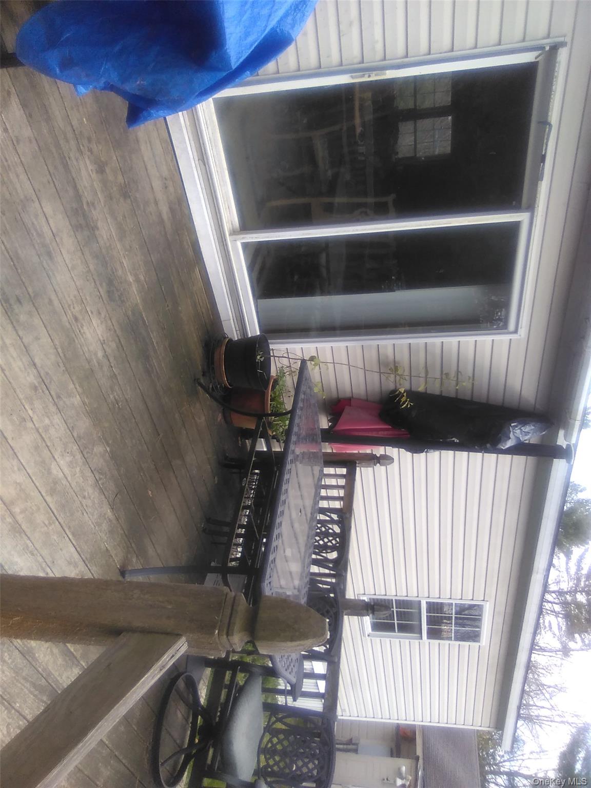 2032 Champlin Road Jefferson, NY 12093 - Photo 20 of 20 a view of a chairs and fire pit in the balcony