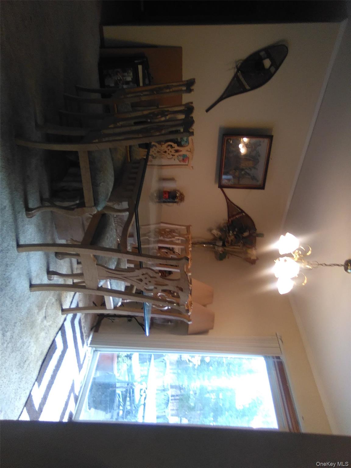 2032 Champlin Road Jefferson, NY 12093 - Photo 5 of 20 a view of a dining room with furniture and chandelier