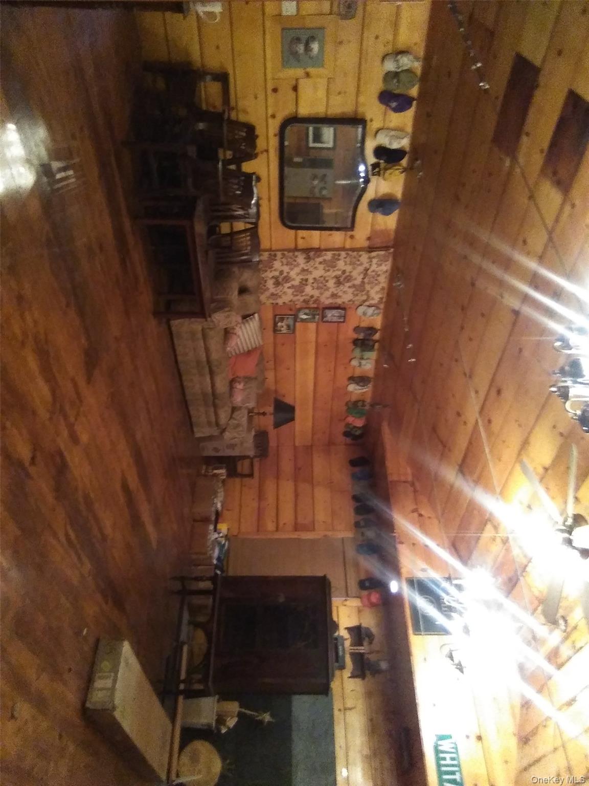 2032 Champlin Road Jefferson, NY 12093 - Photo 6 of 20 a living room with furniture and a flat screen tv