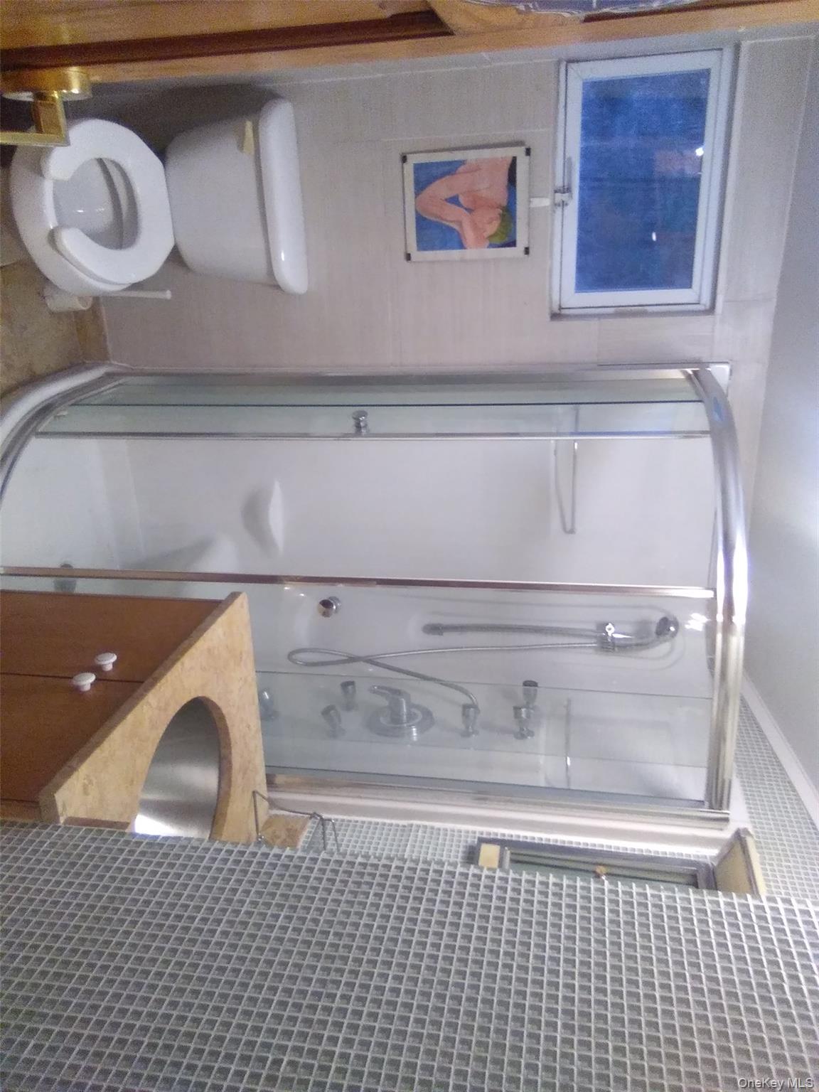 2032 Champlin Road Jefferson, NY 12093 - Photo 9 of 20 a bathroom with a sink a toilet and shower