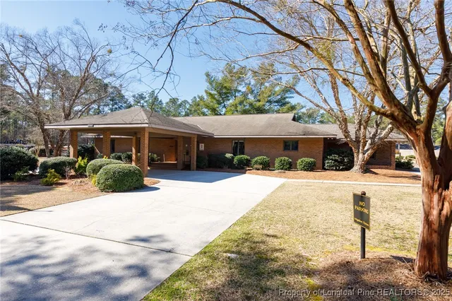 a view of a house with a snow on the road