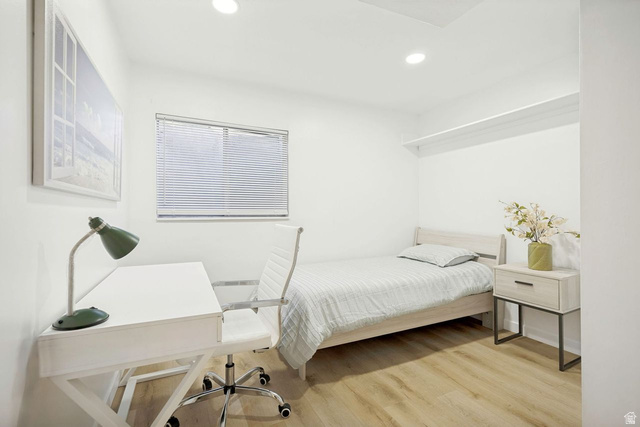 1723 Albury Road Sandy, UT 84092 - Photo 22 of 23 Bright room featuring wood-finish flooring, recessed lighting, and a window with blinds
