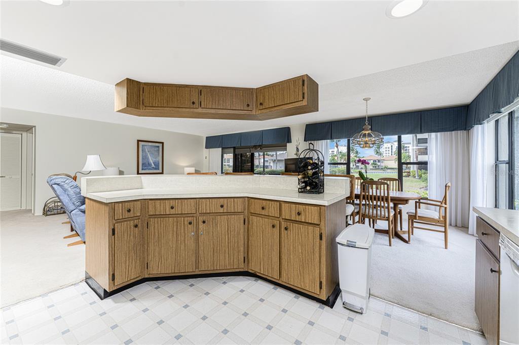 3245 Sugarloaf Key Road, Unit 24A Punta Gorda, FL 33955 - Photo 16 of 52 a kitchen with stainless steel appliances granite countertop a sink and cabinets