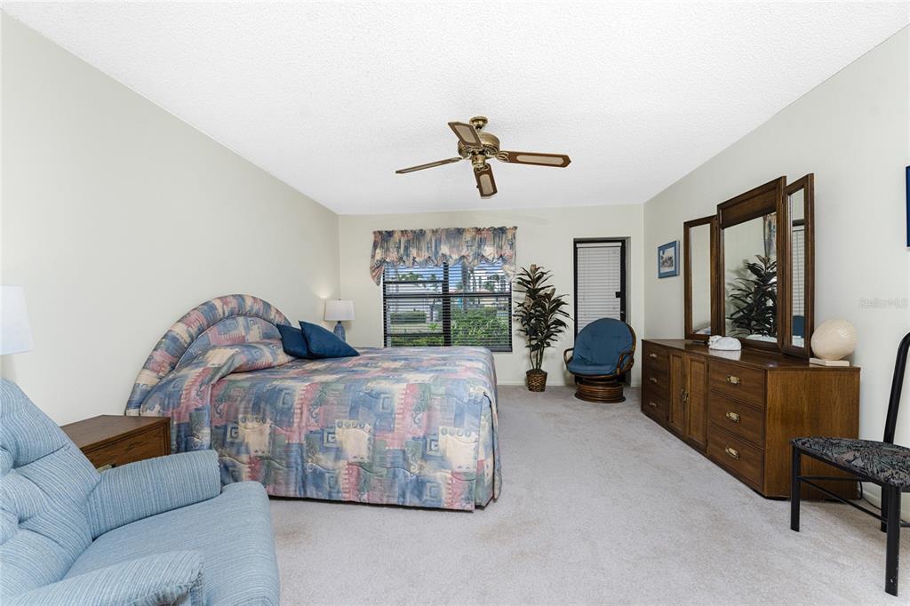 3245 Sugarloaf Key Road, Unit 24A Punta Gorda, FL 33955 - Photo 21 of 52 a living room with furniture fireplace and a large window