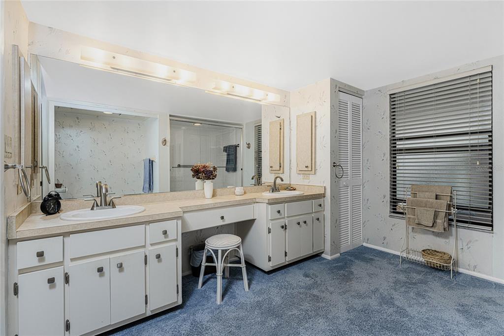 3245 Sugarloaf Key Road, Unit 24A Punta Gorda, FL 33955 - Photo 24 of 52 a spacious bathroom with a double vanity sink double and mirror