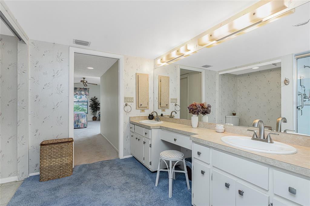 3245 Sugarloaf Key Road, Unit 24A Punta Gorda, FL 33955 - Photo 26 of 52 a spacious bathroom with a granite countertop sink mirror and a