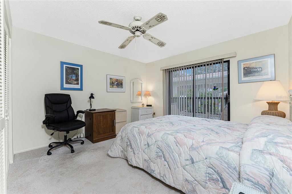 3245 Sugarloaf Key Road, Unit 24A Punta Gorda, FL 33955 - Photo 27 of 52 a bedroom with a bed and a desk