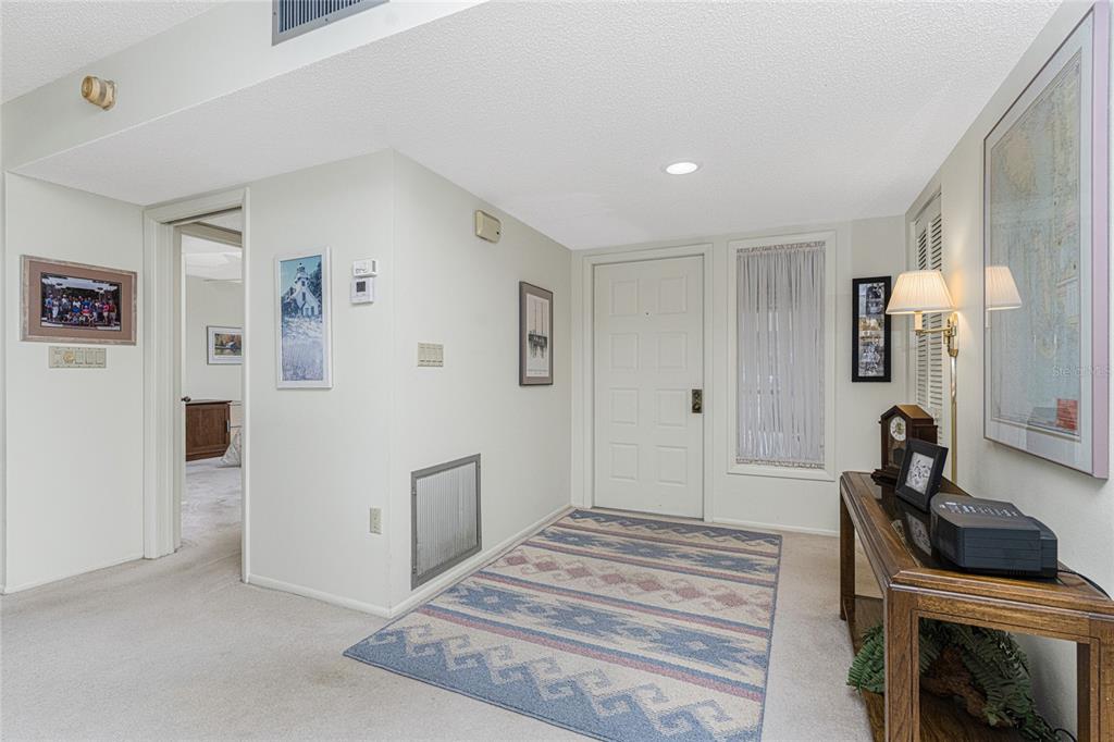 3245 Sugarloaf Key Road, Unit 24A Punta Gorda, FL 33955 - Photo 32 of 52 a bedroom with a bed and a view of bathroom