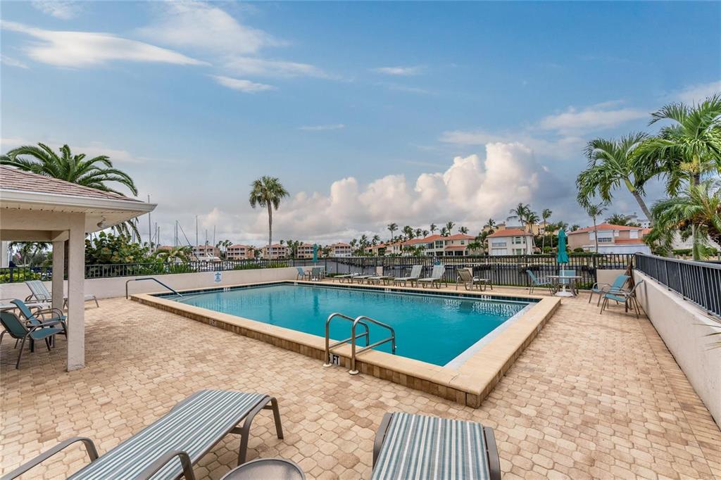 3245 Sugarloaf Key Road, Unit 24A Punta Gorda, FL 33955 - Photo 36 of 52 a view of a swimming pool with outdoor seating