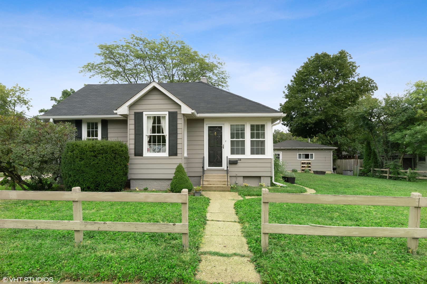 718 Sheridan Road Lake Bluff, IL 60044 - Photo 16 of 36 a front view of a house with a yard