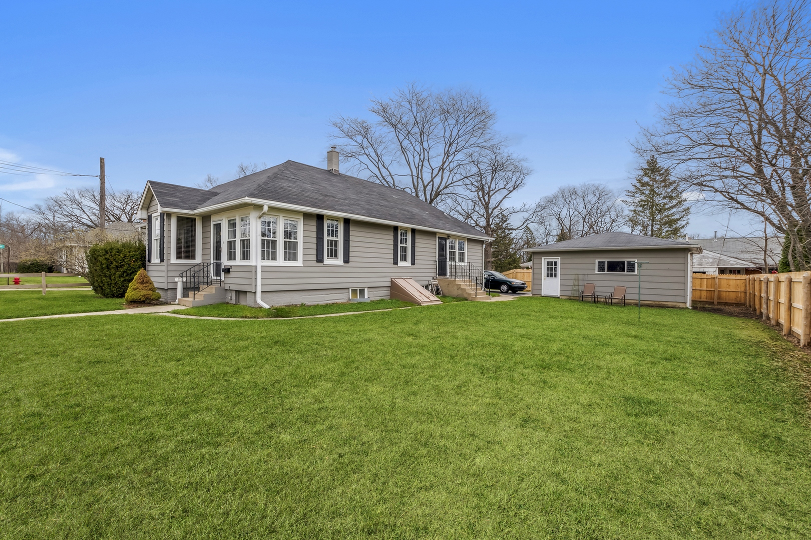 718 Sheridan Road Lake Bluff, IL 60044 - Photo 3 of 36 a front view of a house with a yard