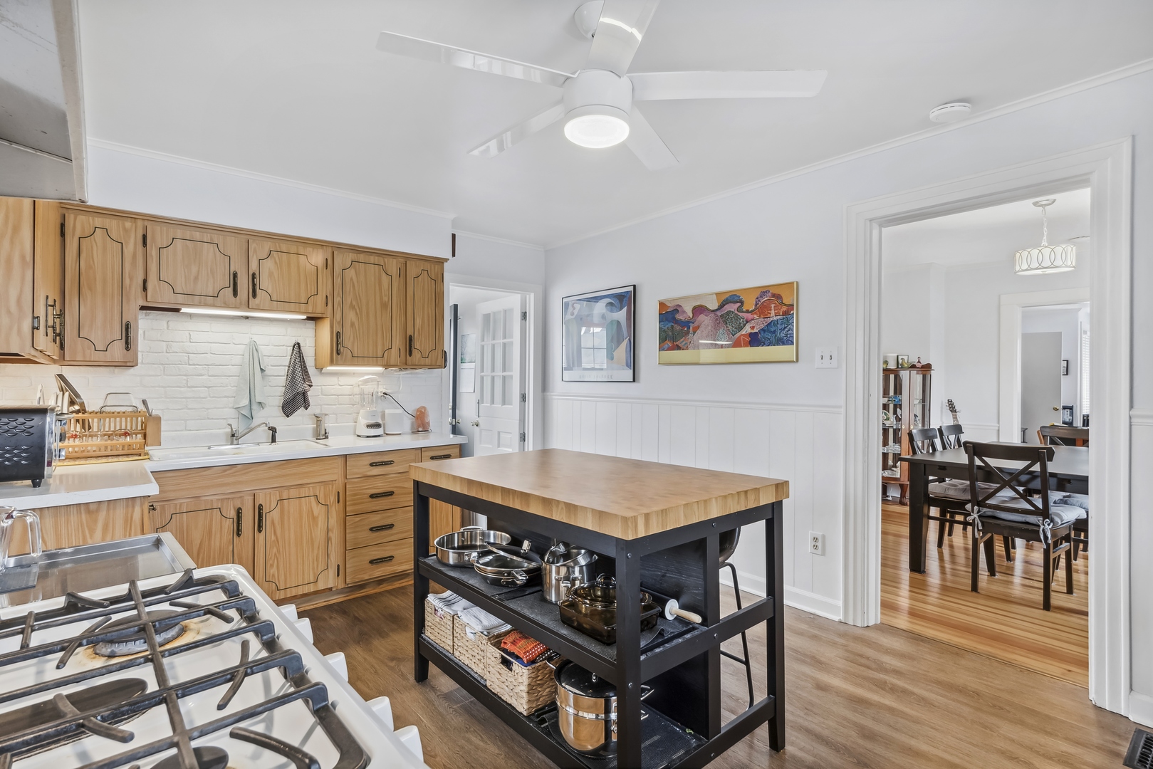 718 Sheridan Road Lake Bluff, IL 60044 - Photo 5 of 36 a kitchen with stainless steel appliances a stove a sink dishwasher and cabinets with wooden floor