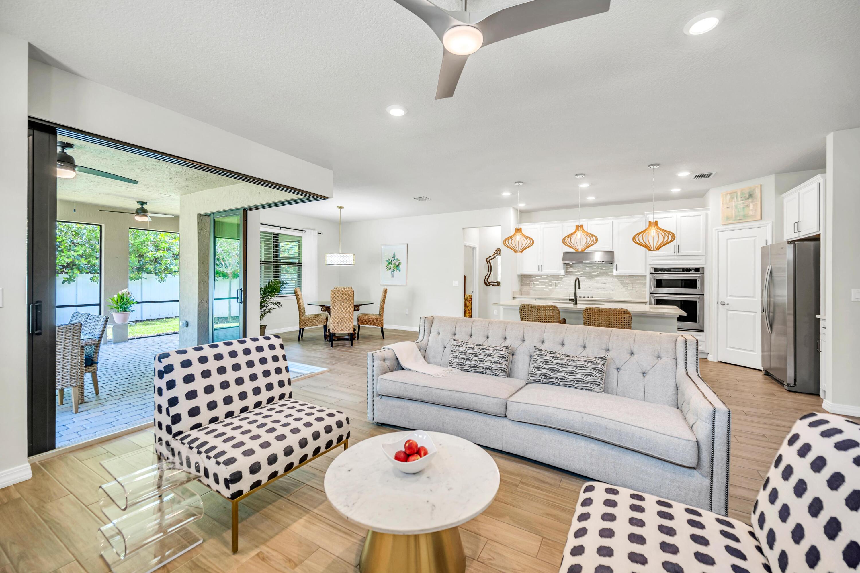 8028 Northwest 78th Street Tamarac, FL 33321 - Photo 19 of 38 a living room with furniture and a large window