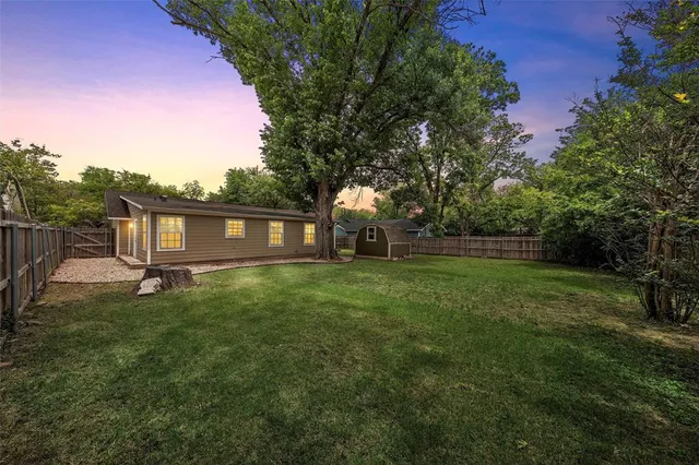 a view of balcony with wooden floor and fence