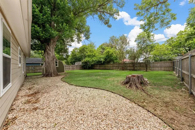 a backyard of a house with lots of green space