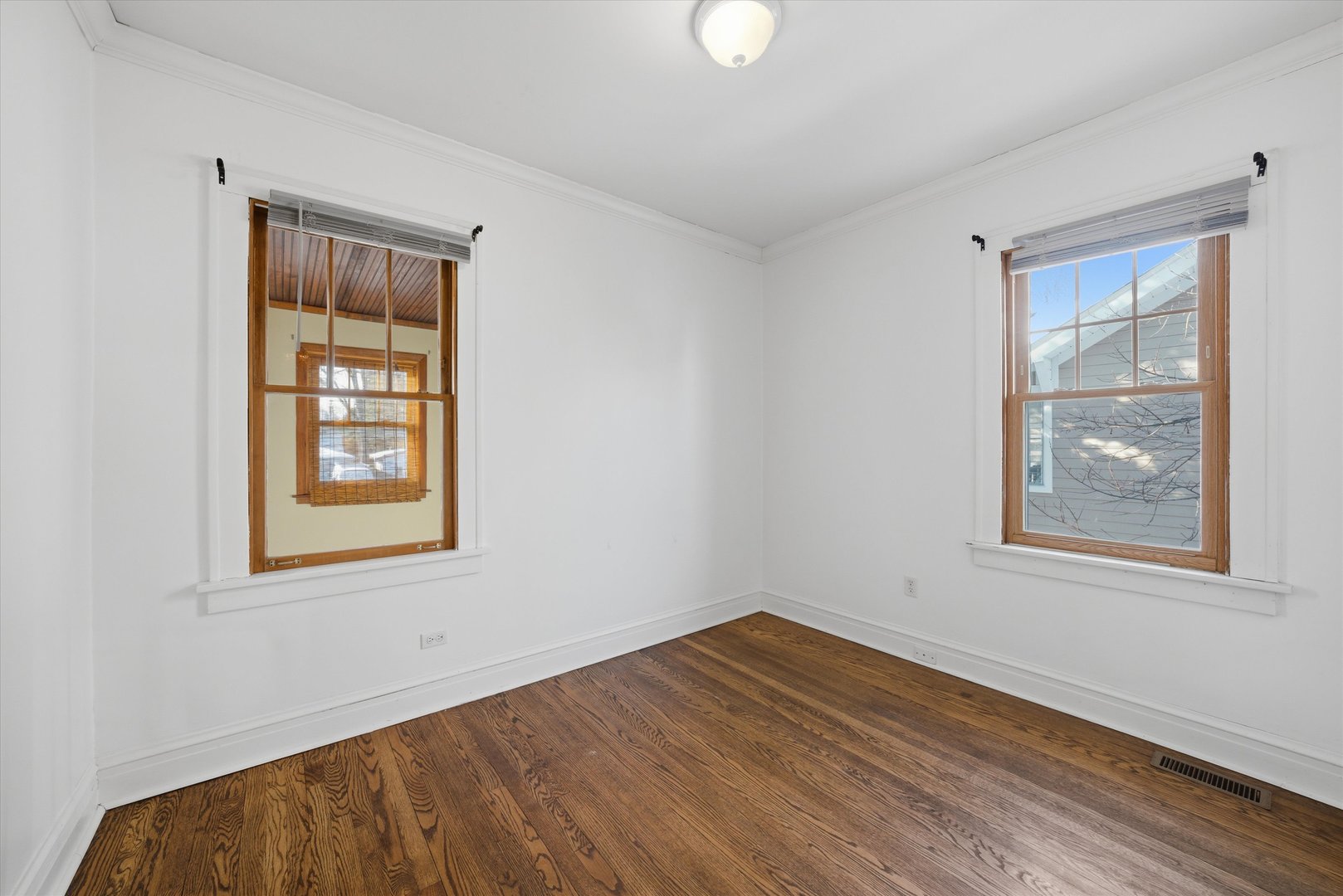 314 Elm Street Lombard, IL 60148 - Photo 13 of 43 a view of an empty room with wooden floor and a window