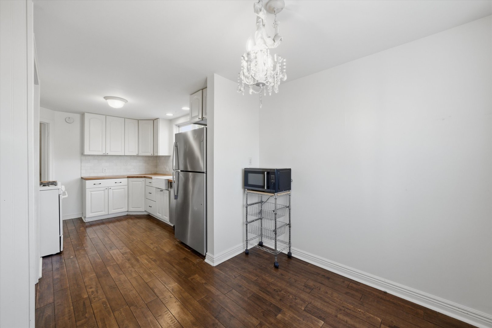 314 Elm Street Lombard, IL 60148 - Photo 22 of 43 a view of kitchen with refrigerator microwave and stove