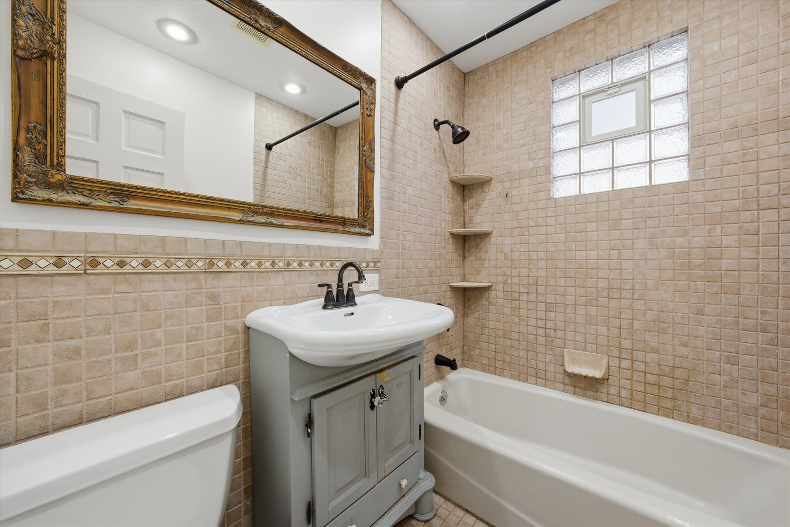 314 Elm Street Lombard, IL 60148 - Photo 29 of 43 a bathroom with a sink a toilet and shower