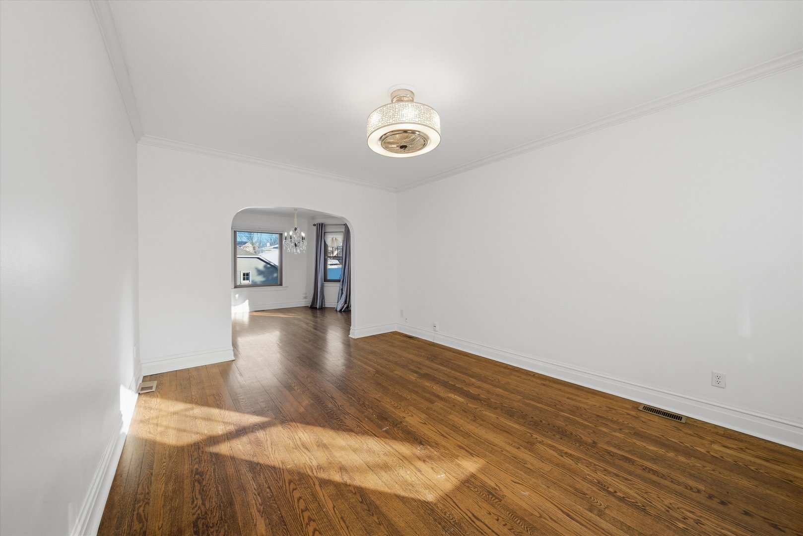 314 Elm Street Lombard, IL 60148 - Photo 6 of 43 a view of a room with wooden floor and window
