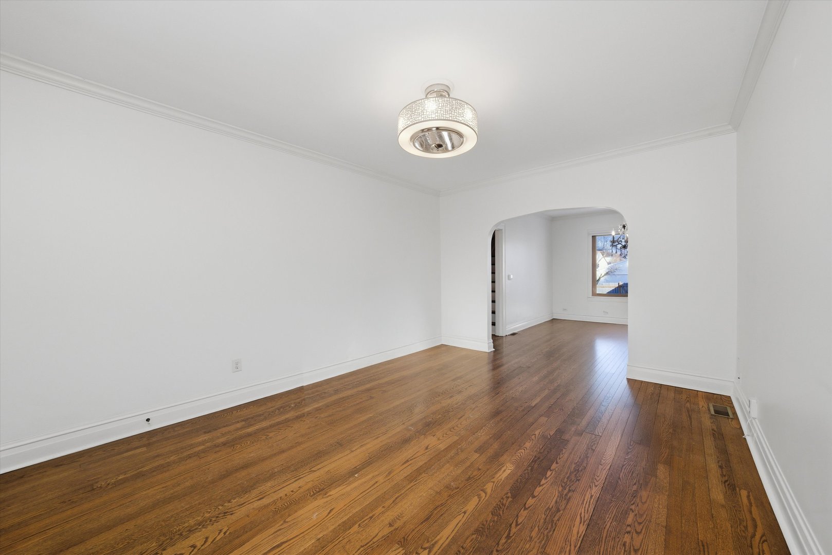 314 Elm Street Lombard, IL 60148 - Photo 8 of 43 a view of empty room with wooden floor and fan