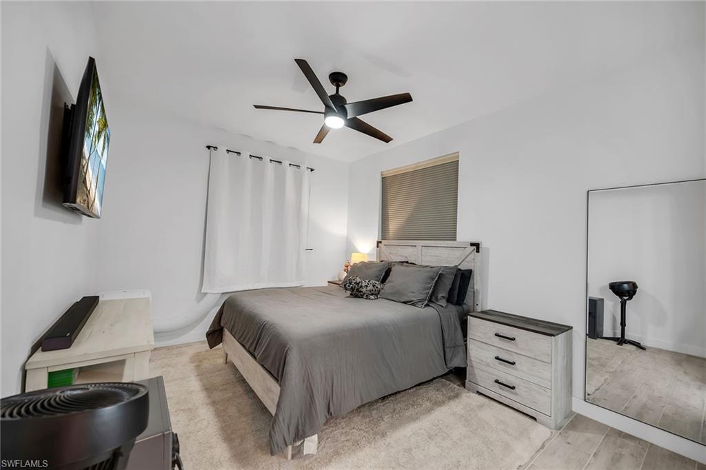 4620 St Croix Lane, Unit 918 Naples, FL 34109 - Photo 12 of 43 a bedroom with a bed and furniture