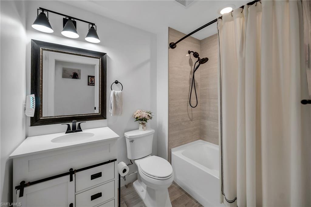 4620 St Croix Lane, Unit 918 Naples, FL 34109 - Photo 16 of 43 a bathroom with a sink toilet and shower