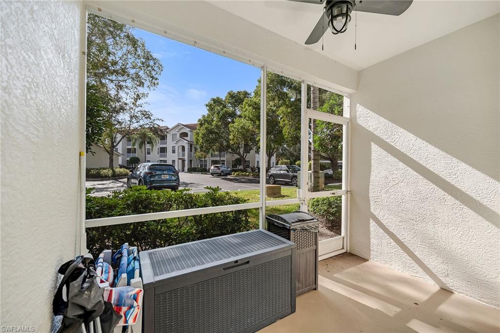 4620 St Croix Lane, Unit 918 Naples, FL 34109 - Photo 19 of 43 a view of a porch with furniture and a gate