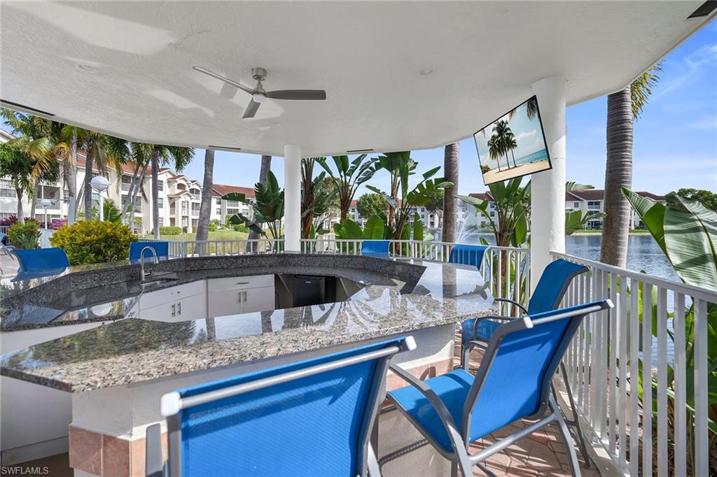 4620 St Croix Lane, Unit 918 Naples, FL 34109 - Photo 28 of 43 a kitchen view with stainless steel appliances granite countertop a sink and a counter top space
